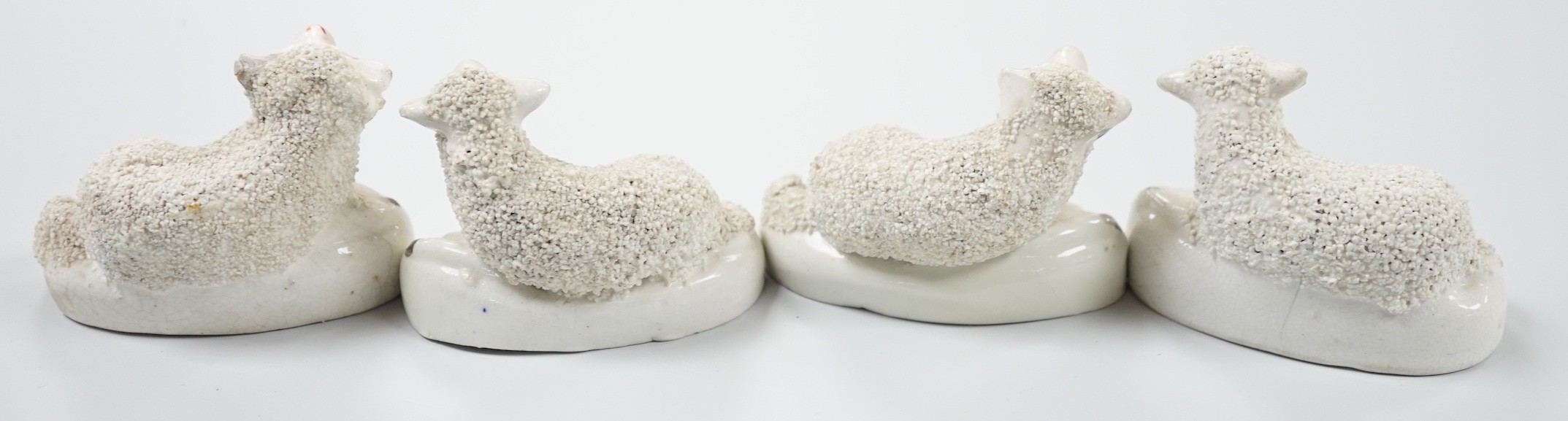 Four small Staffordshire models of recumbent sheep, c.1830-50. 8.5cm long, Provenance: Dennis G.Rice collection
